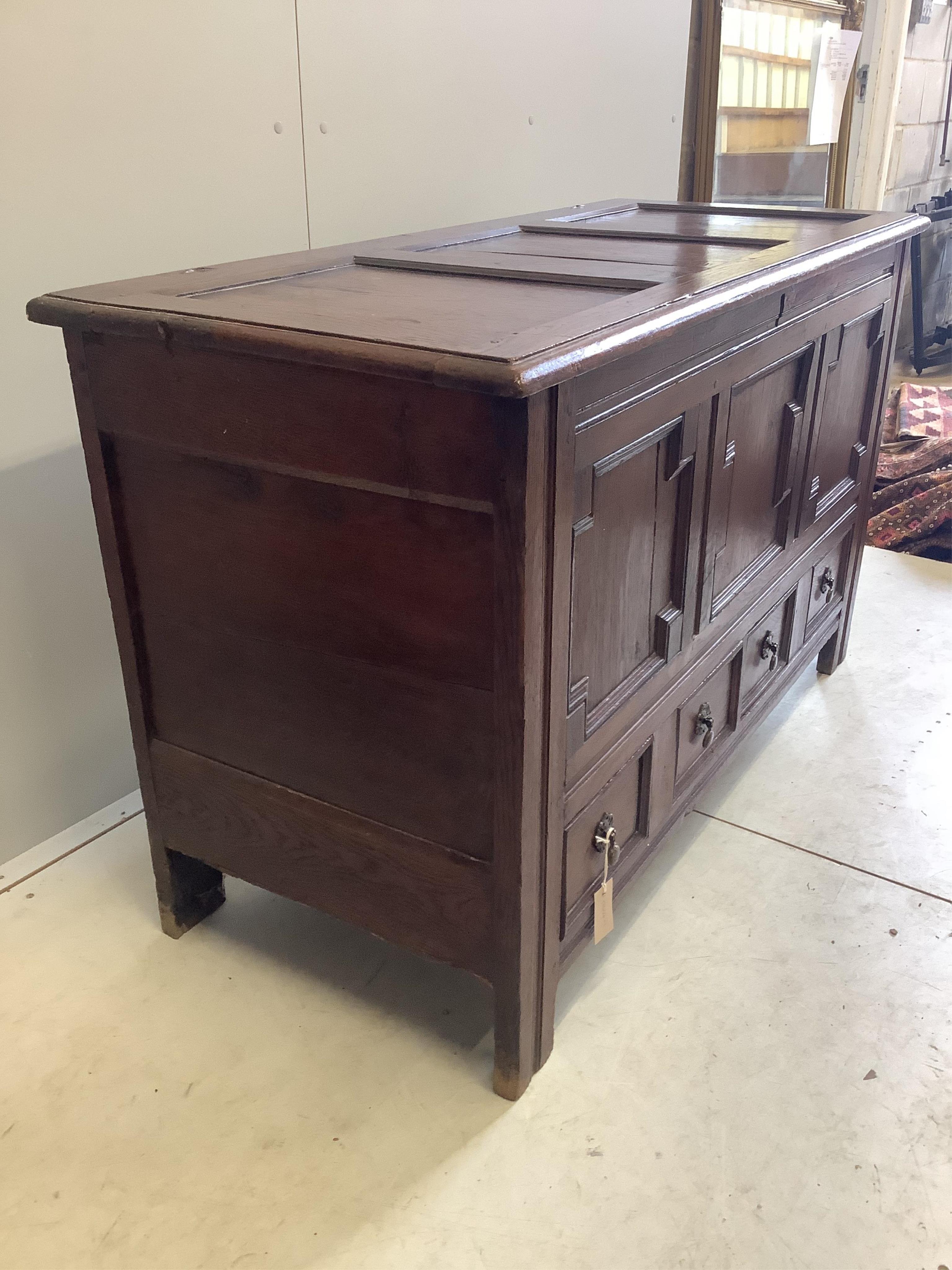 An 18th century panelled oak mule chest, width 126cm, depth 54cm, height 76cm. Condition - fair